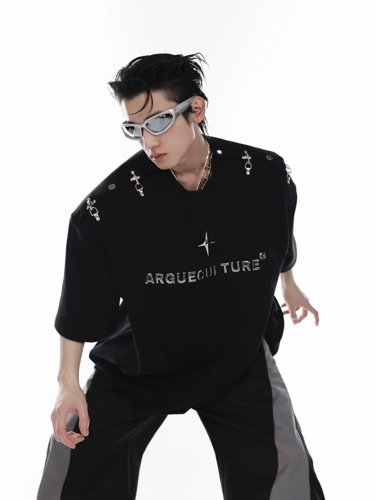 Avant-garde unisex streetwear tee with bold 3D cutting and metal clip shoulder detailing for edgy summer style