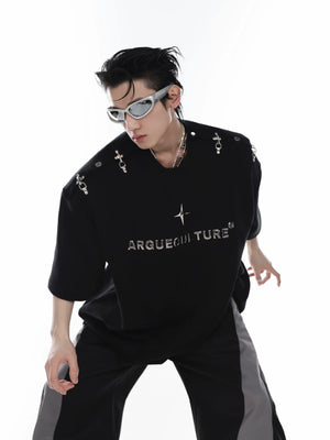 Avant-garde unisex streetwear tee with bold 3D cutting and metal clip shoulder detailing for edgy summer style