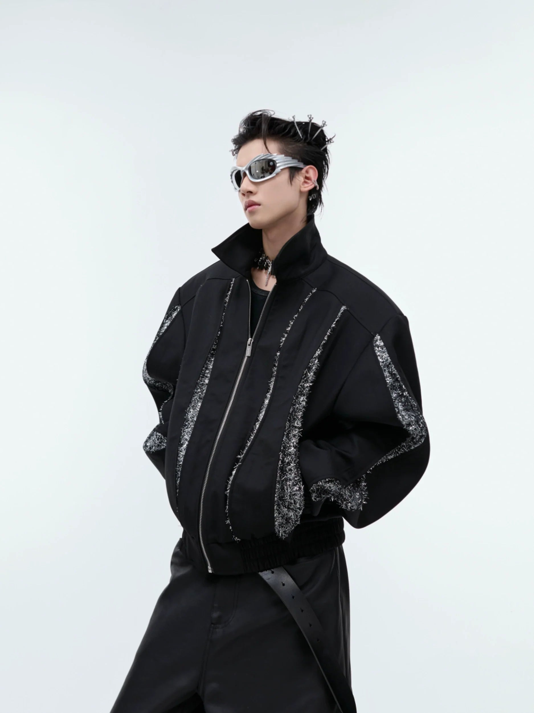 Black deconstructed cropped jacket with sequin trim details, avant-garde streetwear fashion with metallic accents