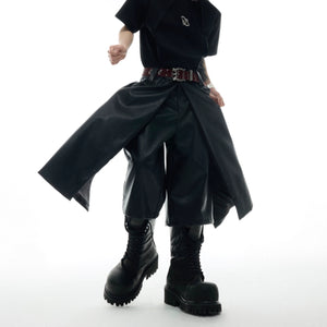 Front view of deconstructed leather shorts showing unique double-layer edge design and loose fit for streetwear fashion