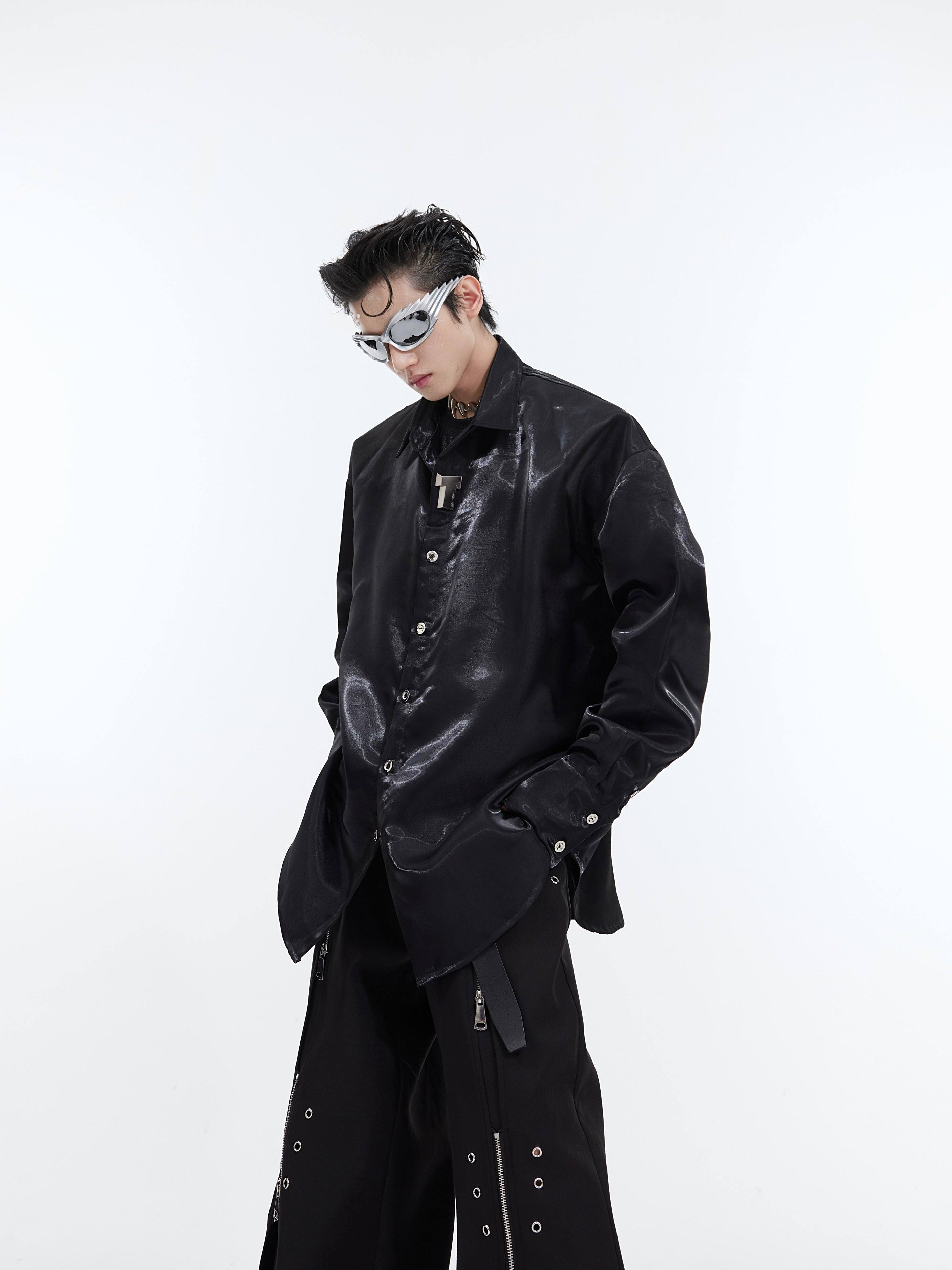 Oversized streetwear shirt with metallic trim details and liquid-shine fabric catching the light