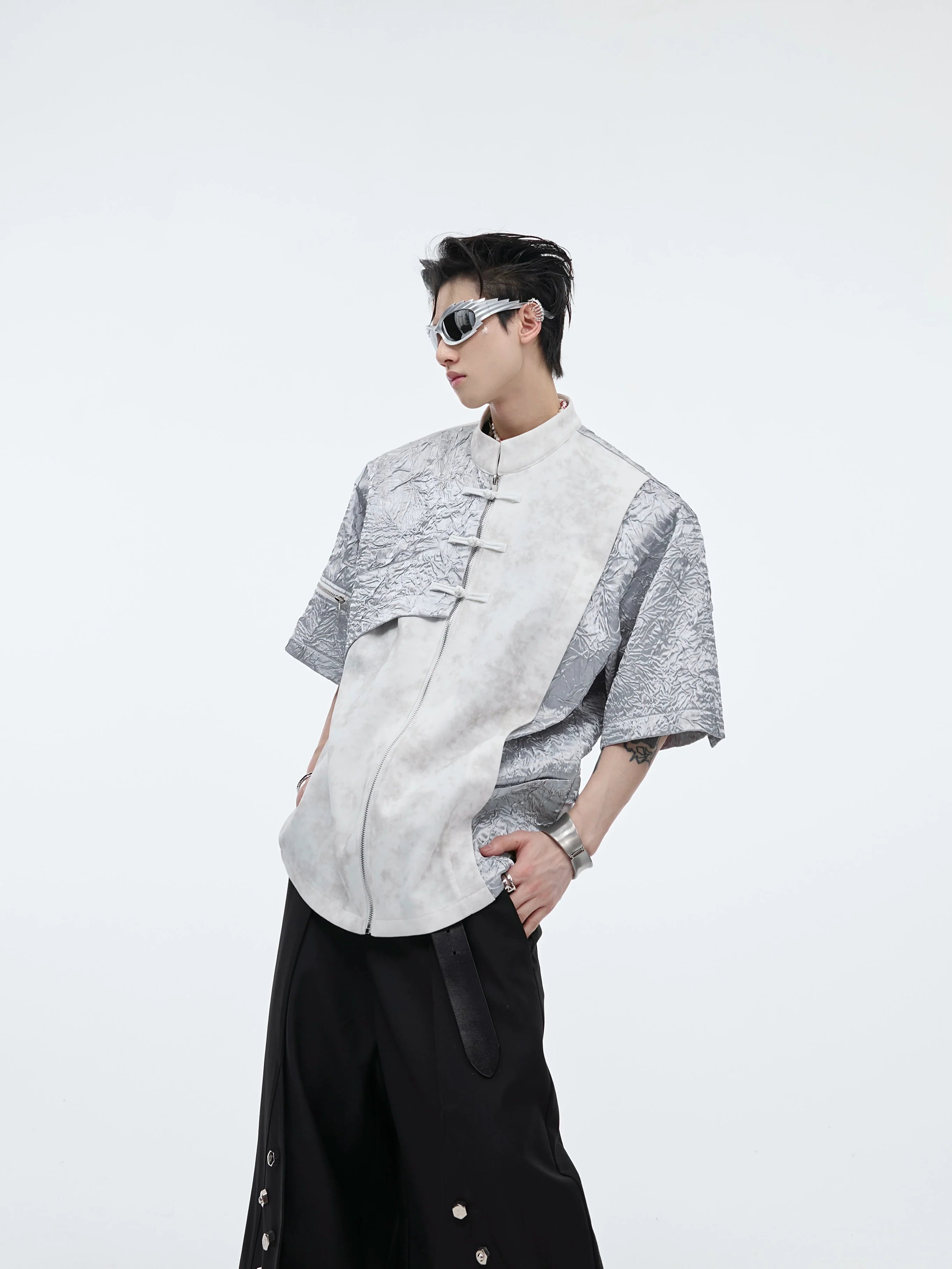 Front view of deconstructed mandarin collar sleeveless tee showing oversized streetwear design and unique stitching details