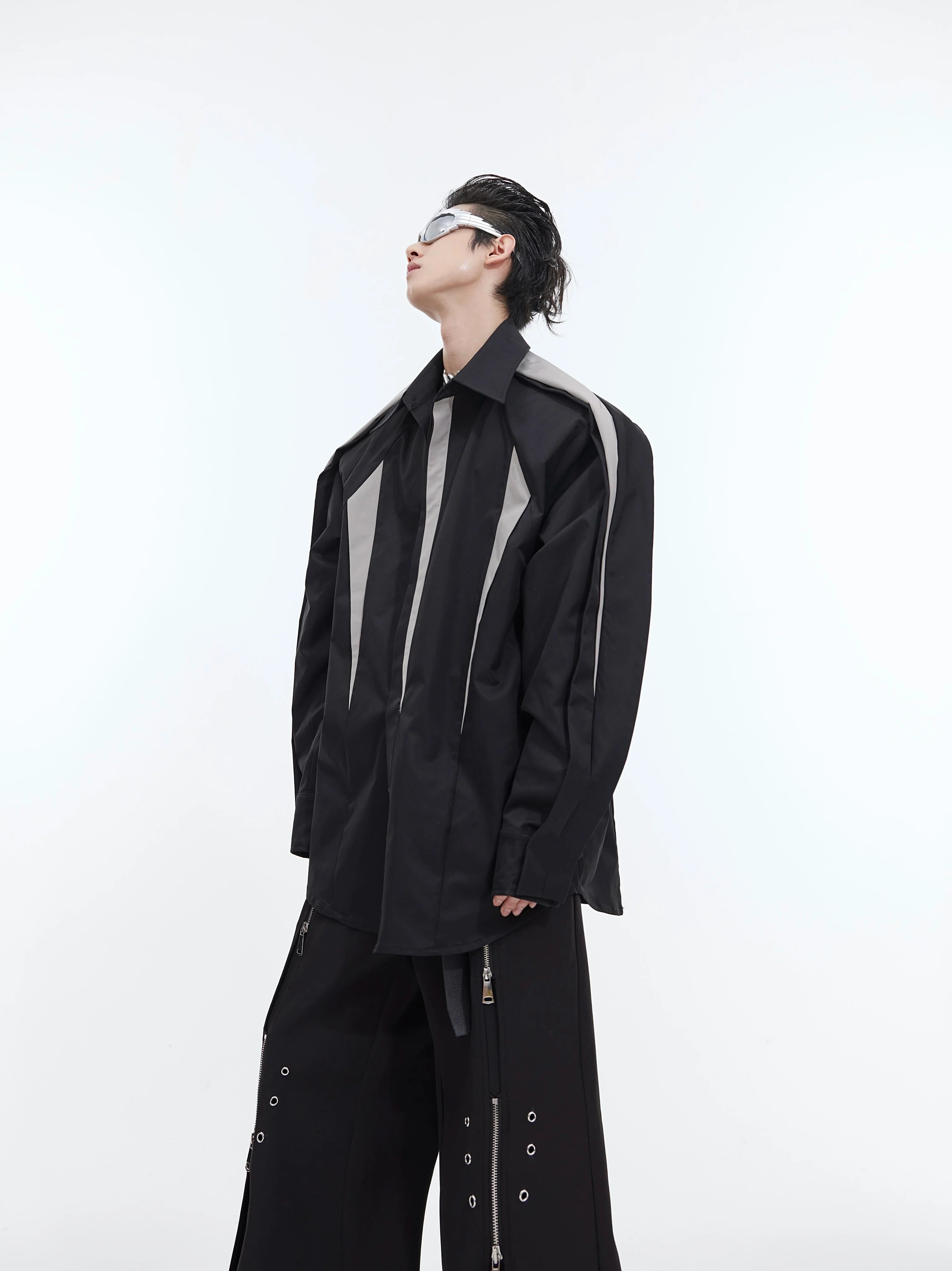Deconstructed overshirt with unique split-shoulder design and patchwork detailing for avant-garde streetwear style