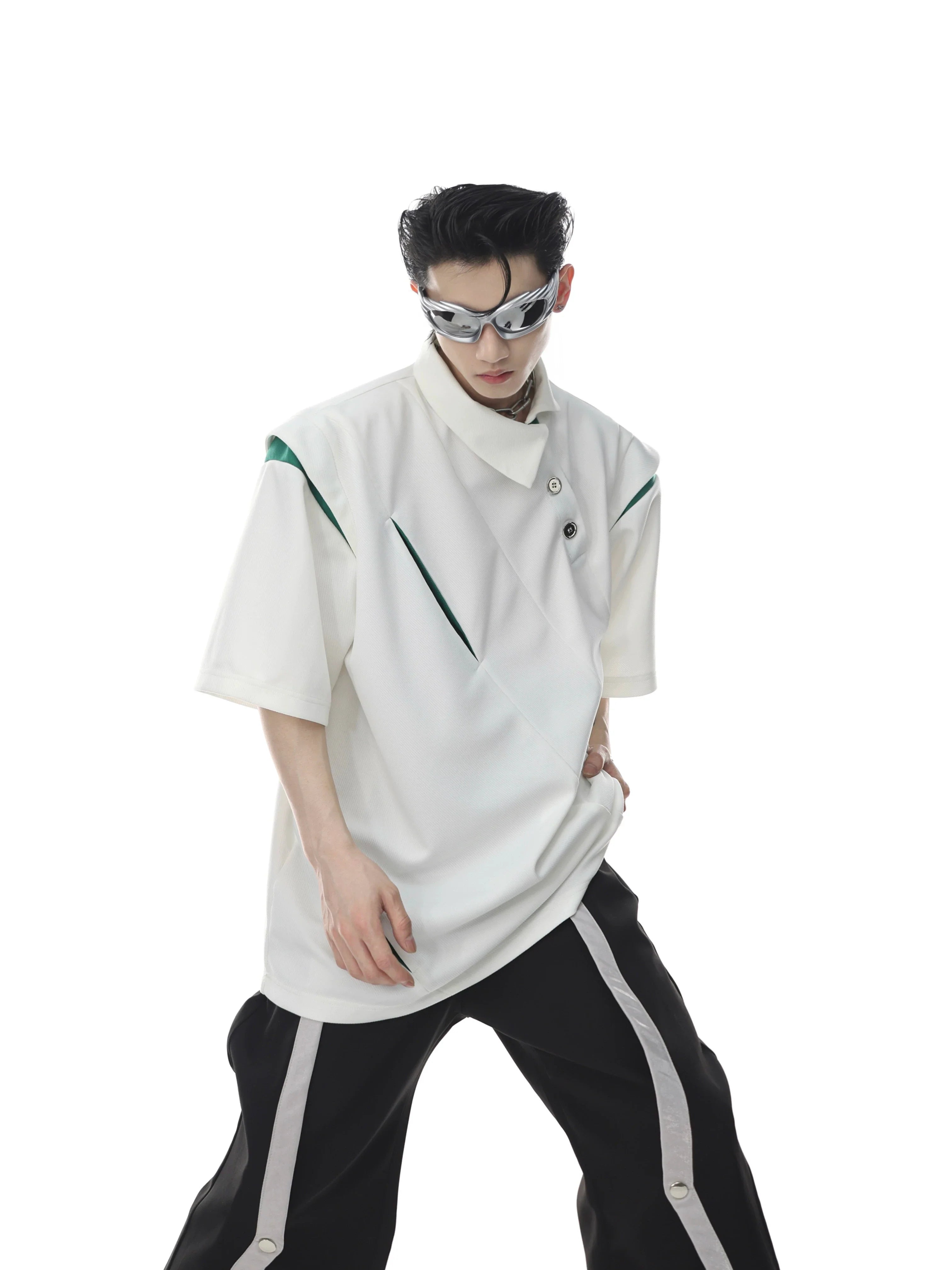 Front view of deconstructed polo shirt featuring asymmetrical collar and metal buttons, modern streetwear style