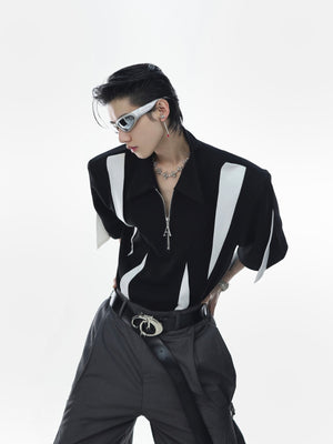 Layflat view showing full deconstructed polo shirt with visible multi-panel construction and urban style