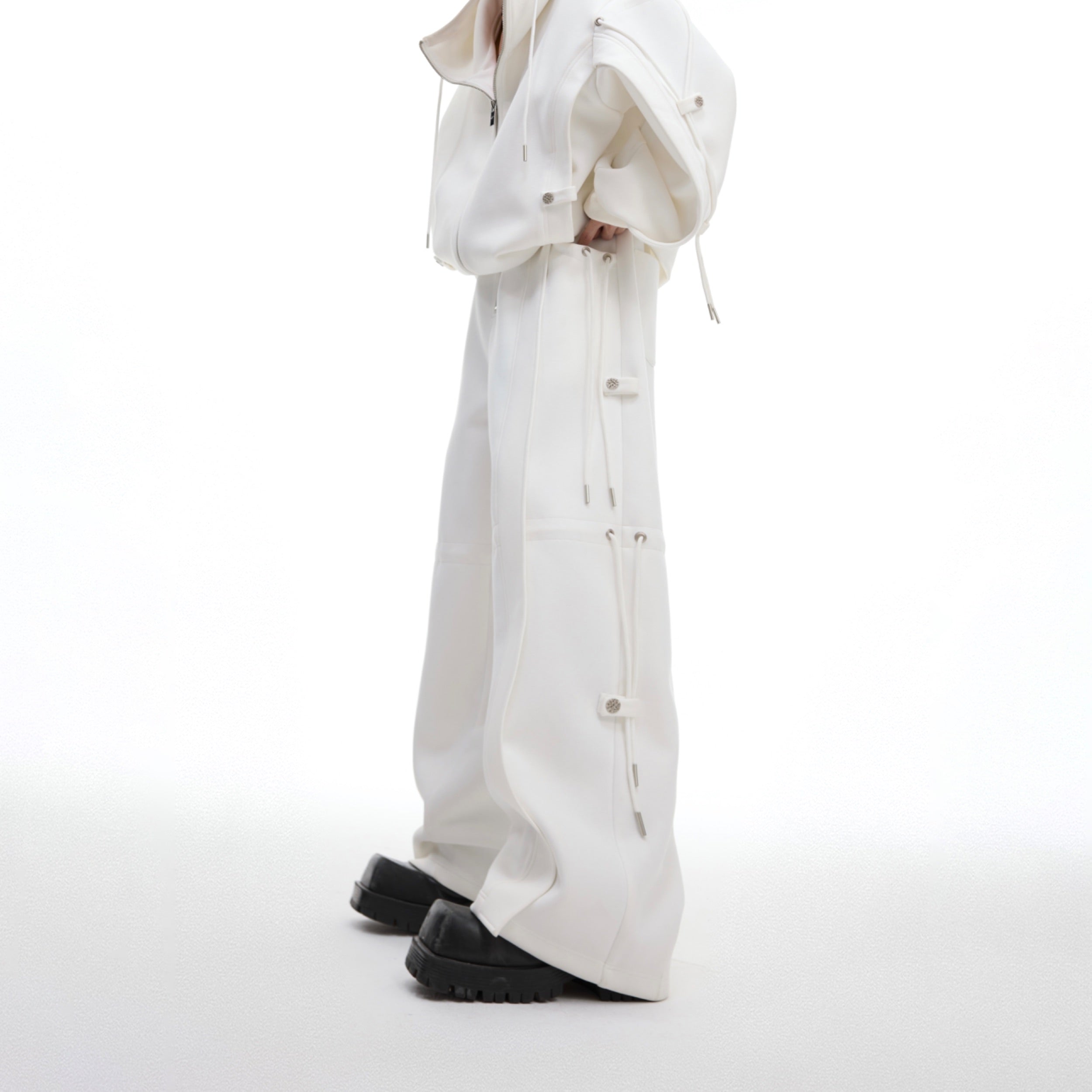 Deconstructed ribbon-waist jogger pants with loose stacked streetwear design for urban fashion