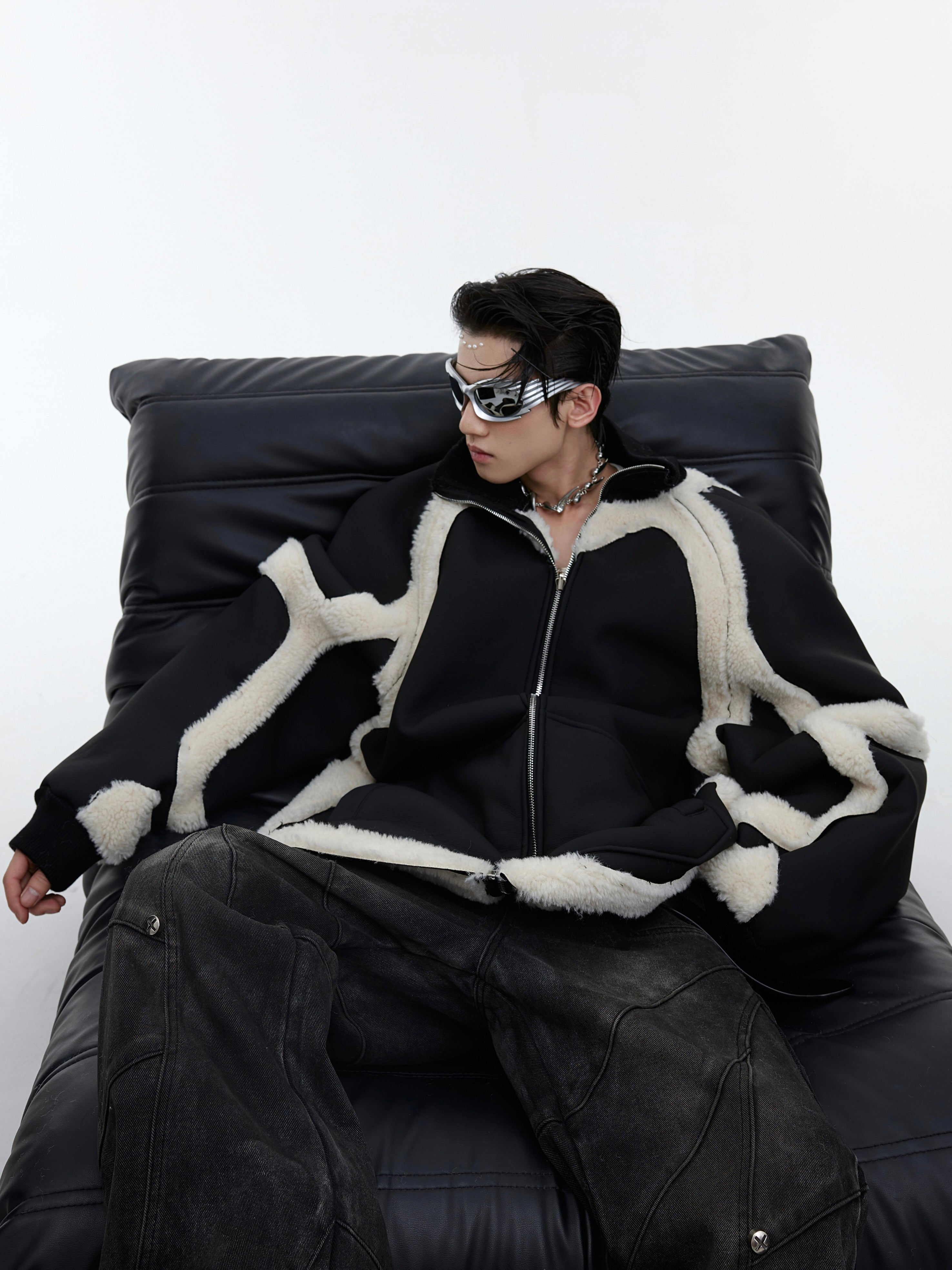 Deconstructed shearling bomber jacket with faux fur collar and oversized streetwear silhouette