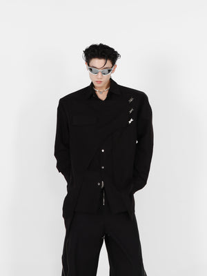 Close-up of the deconstructed shoulder pad and metal detailing on this long sleeve streetwear shirt