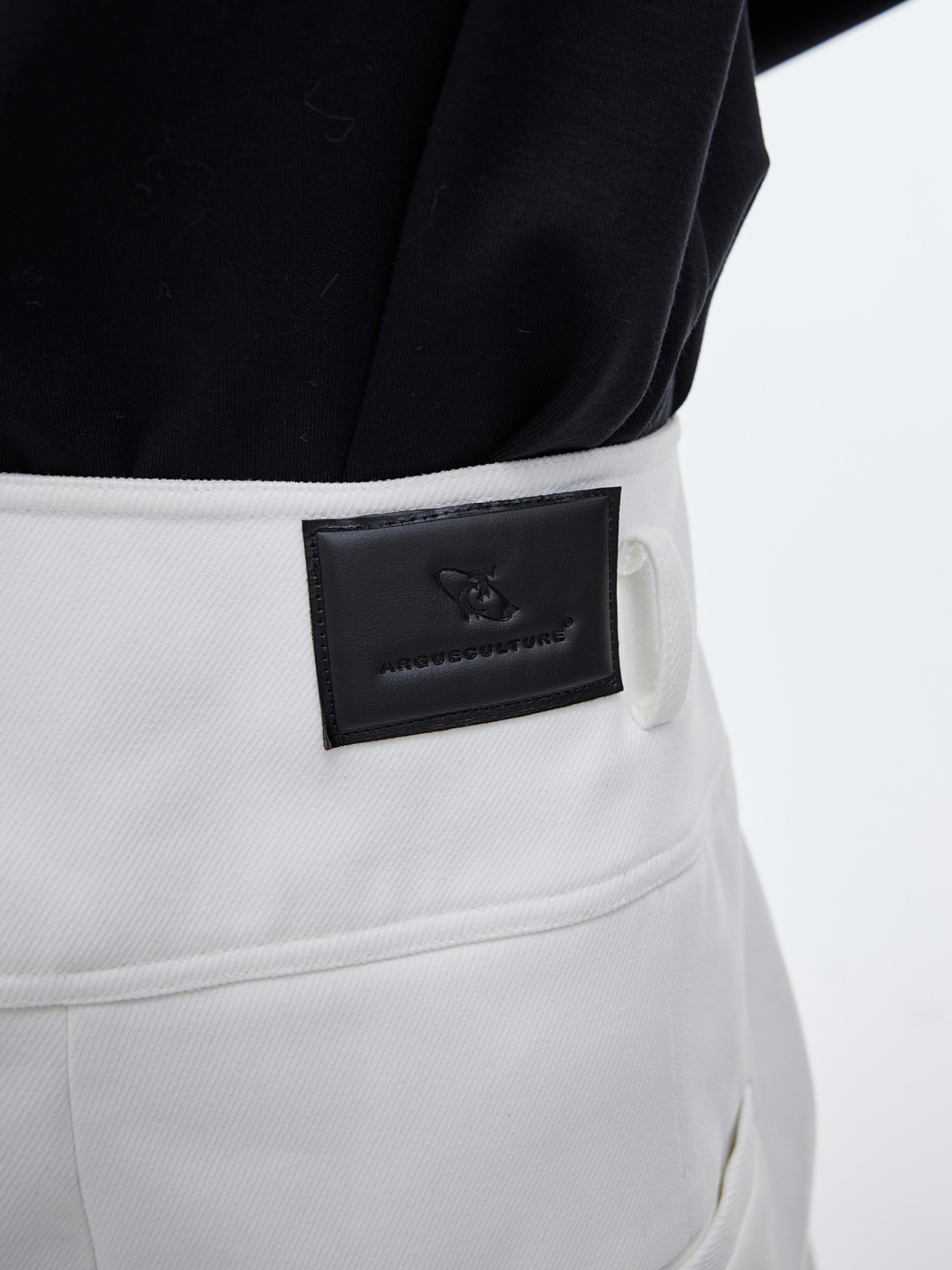 Deconstructed wide-leg pants showing wrap-around streamer accents, trendy oversized trousers for street style