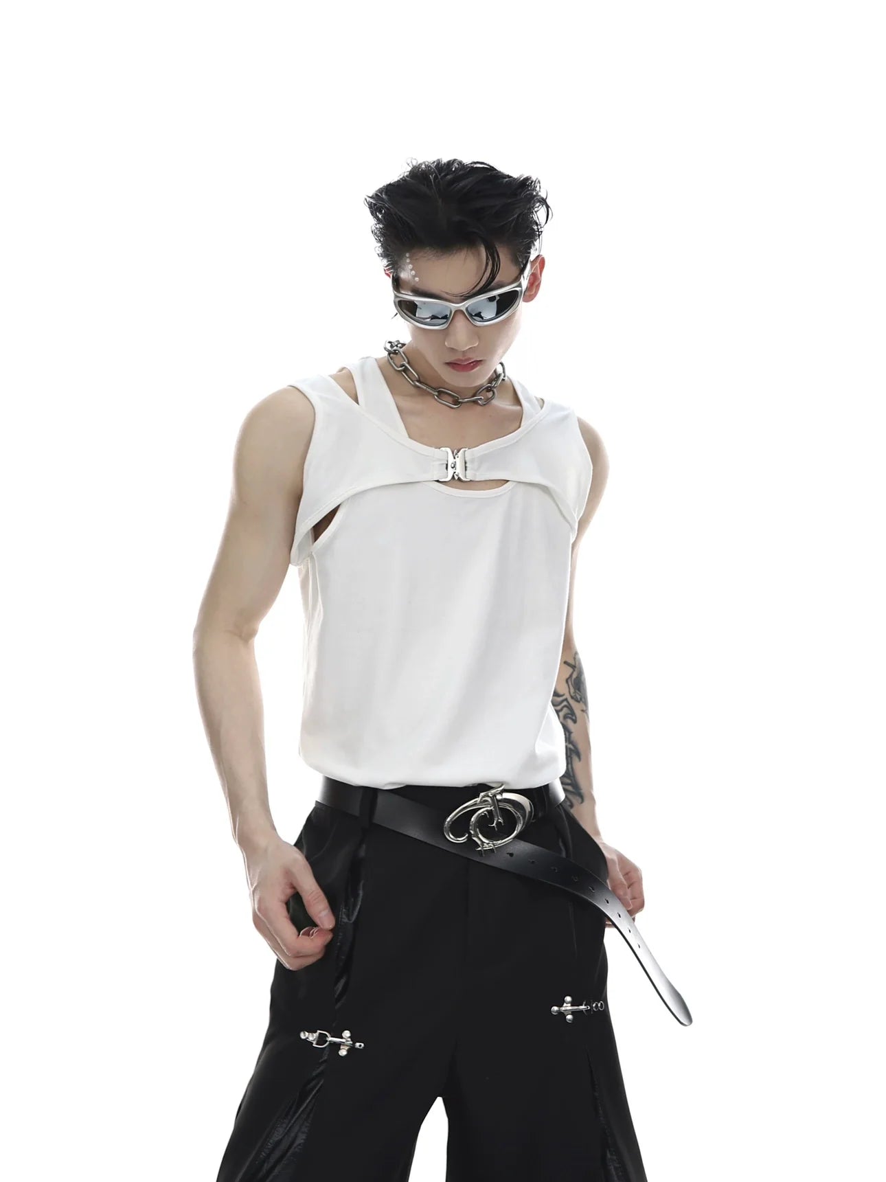 Deconstructed tank top with metal buckle detail, showing front view of the streetwear essential top with edgy design