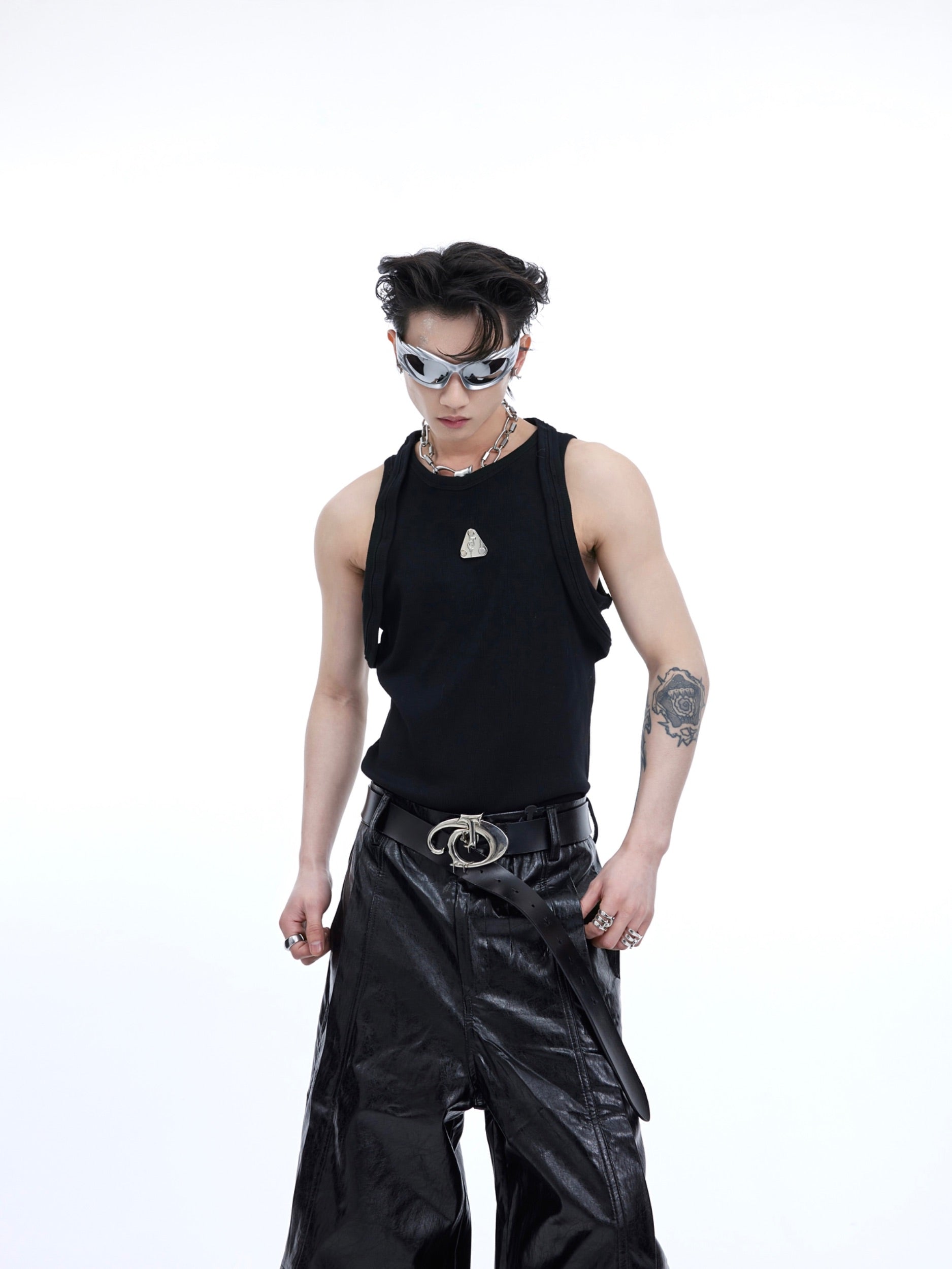 Front view of deconstructed ribbed tank top with double straps and metallic logo detail, perfect for streetwear outfits