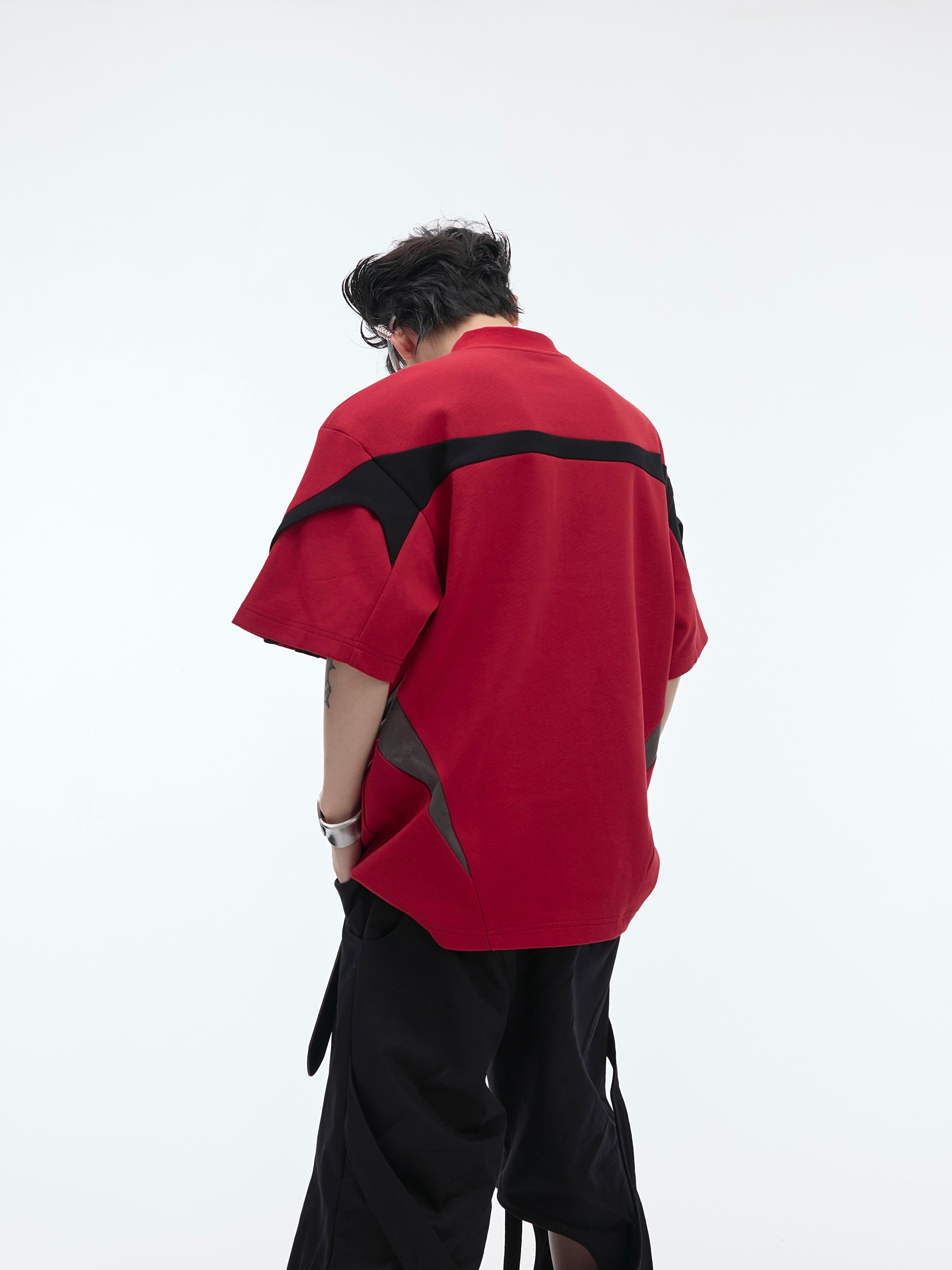 Side angle showing asymmetrical geometric design and breathable fabric of this unique summer streetwear sleeveless top