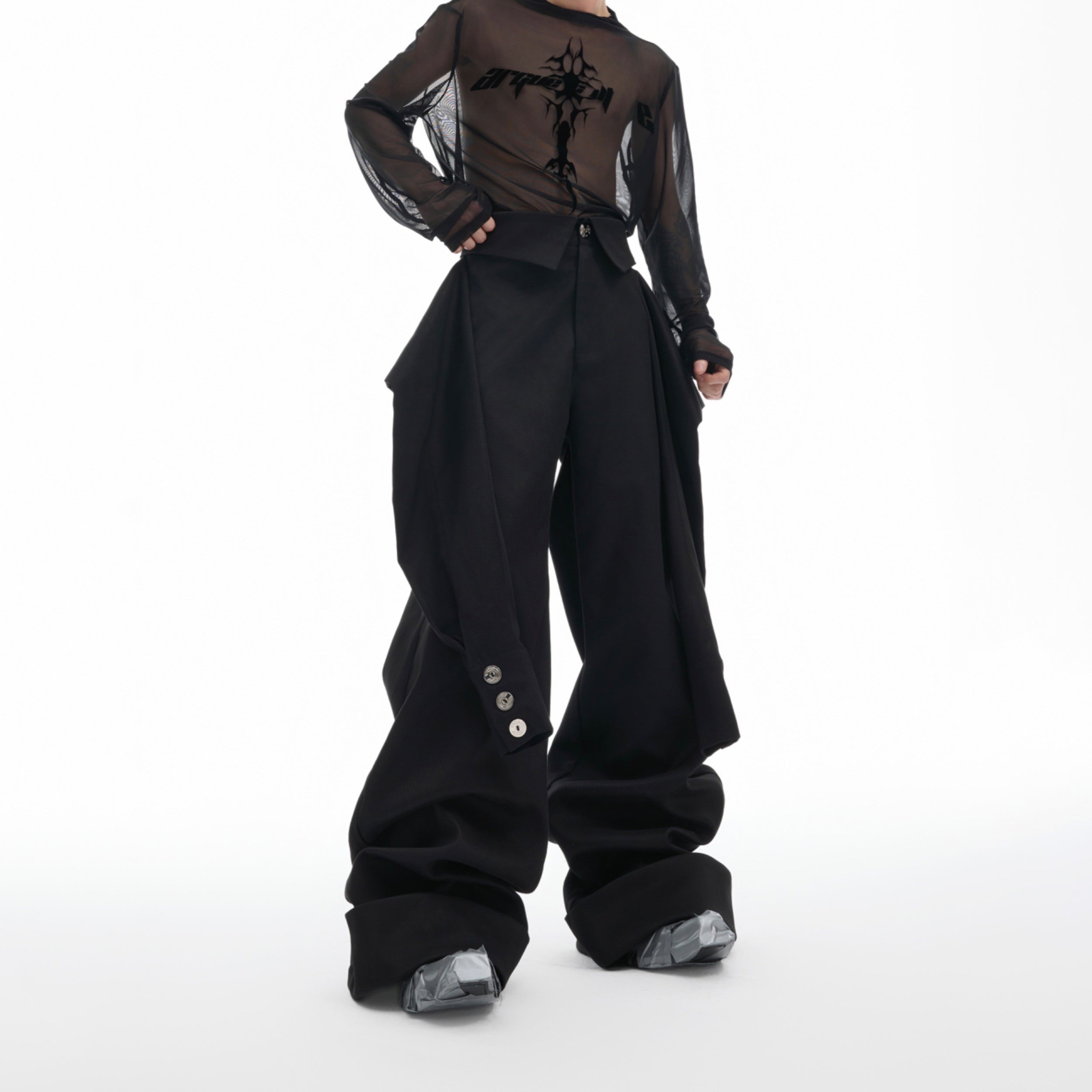 Streetwear pants with deconstructed sleeve details and prominent metal buckle accents, relaxed fit for urban fashion