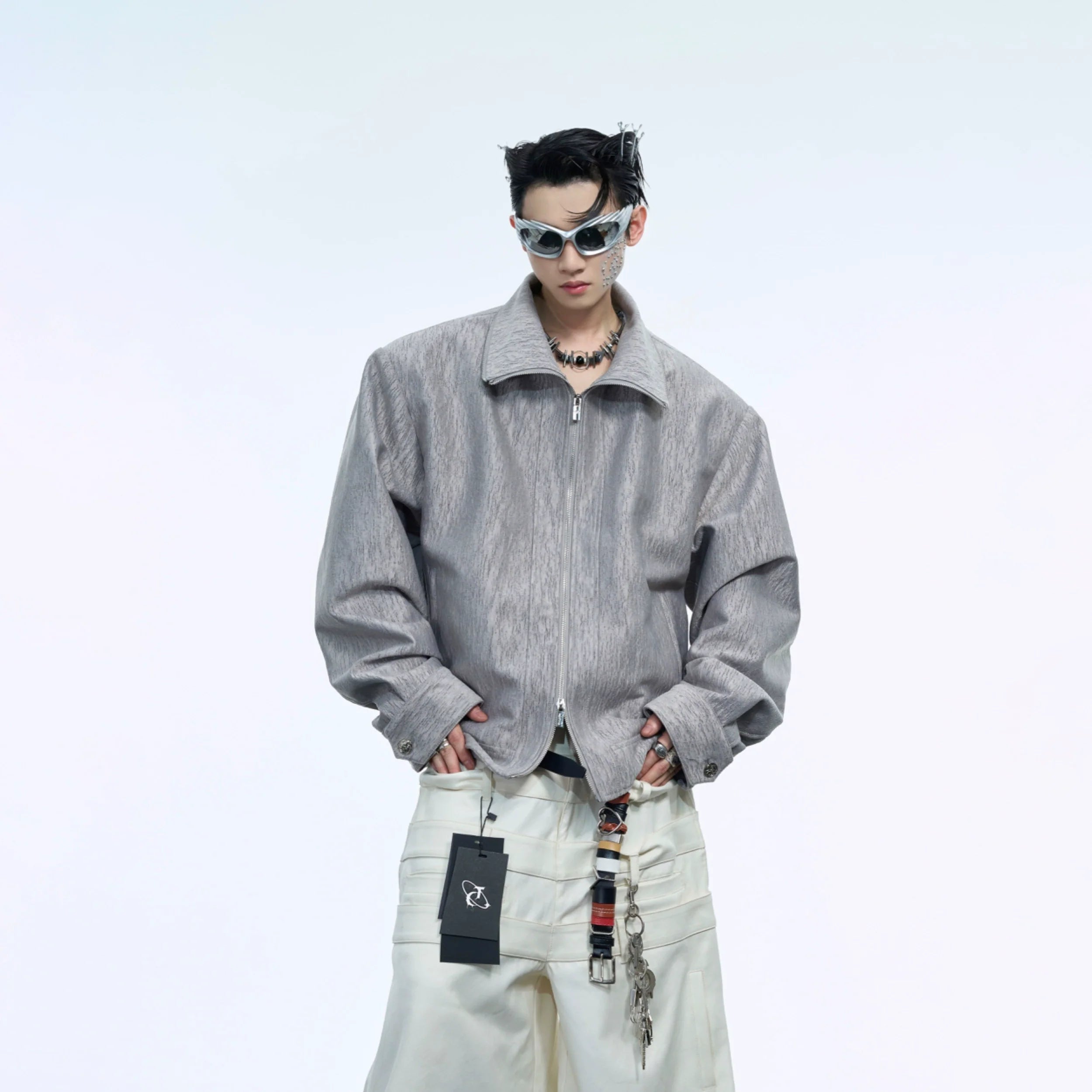 Deconstructed vest jacket with multi-way styling options, featuring detachable cape for urban streetwear looks