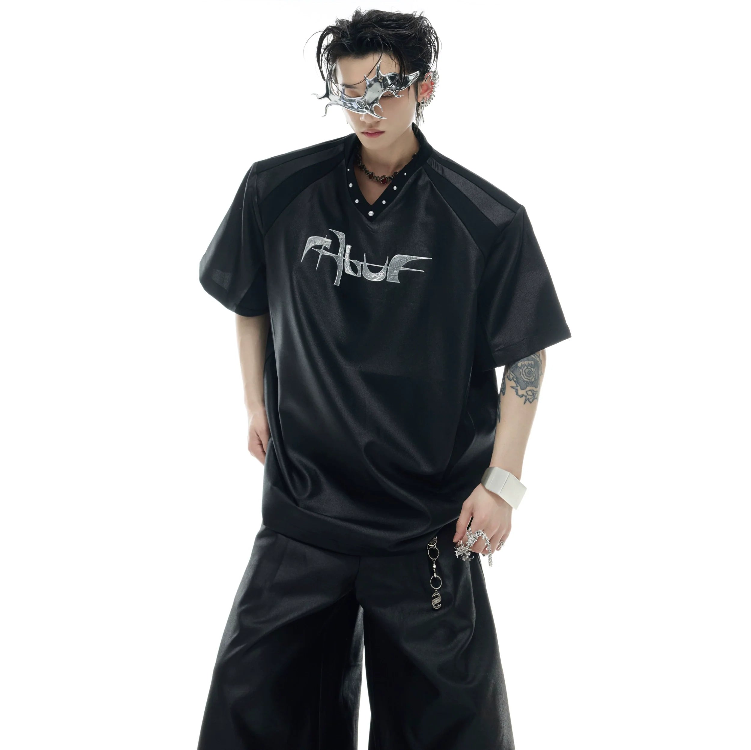 Deconstructed pearl-trim V-neck streetwear tee with oversized fit and urban edge details