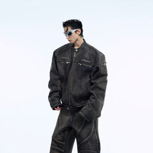 Detail shot of vintage denim jacket showing heavy-duty zippers and functional pockets with metal hardware