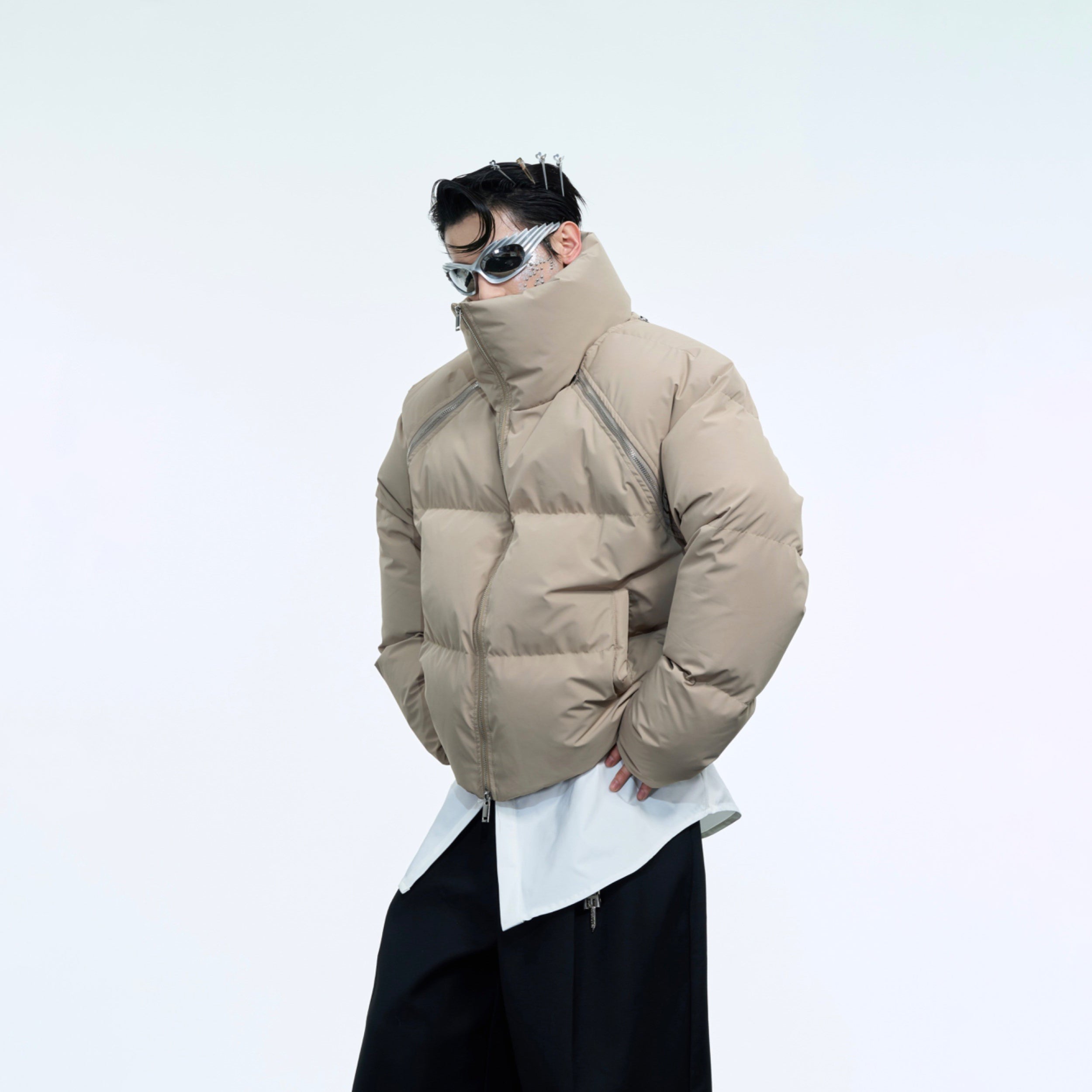 Side angle of heavyweight puffer coat featuring detachable sleeves for versatile styling options