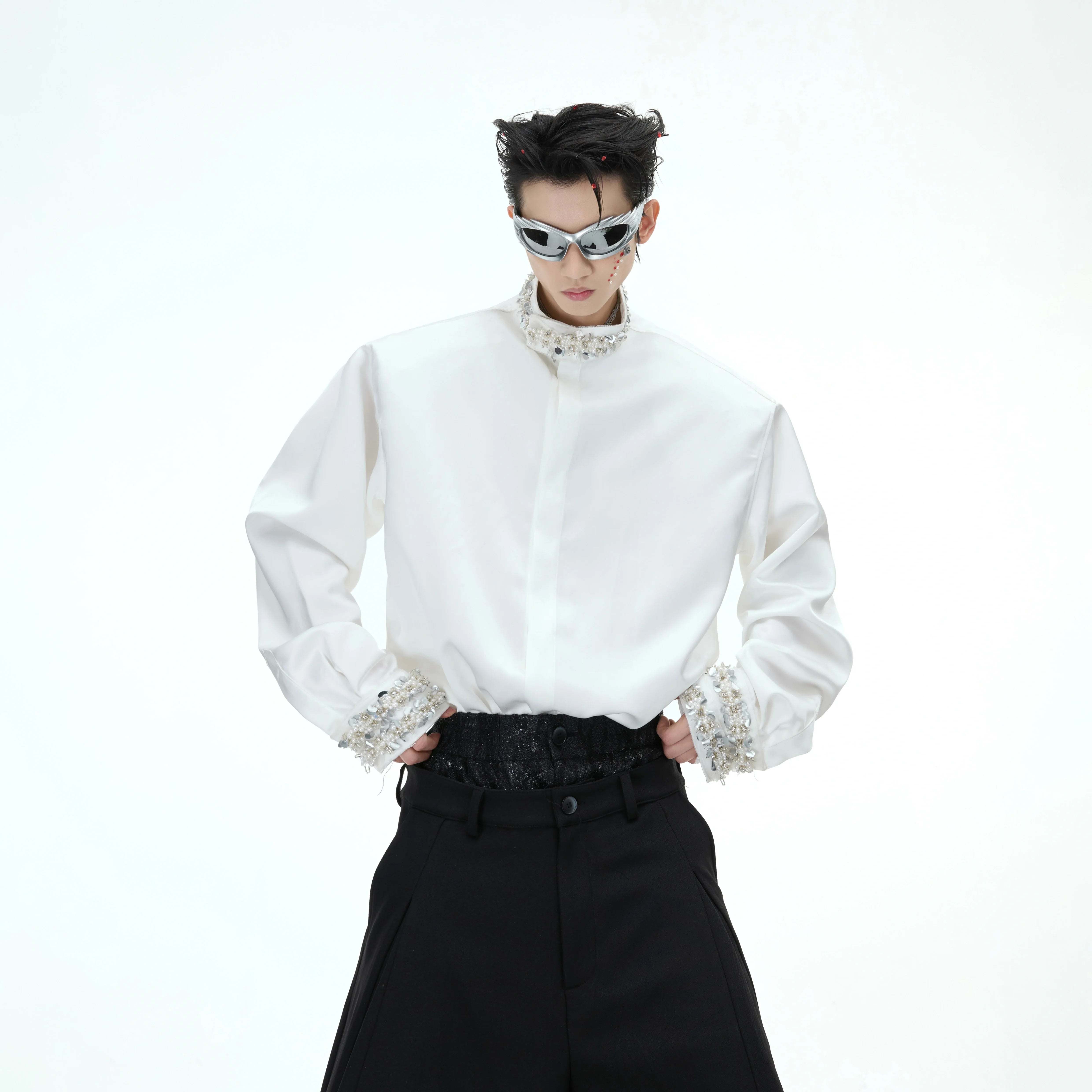 Luxury diamond-trimmed satin shirt with detachable shoulder pads, showcasing elegant streetwear style and pearl accents