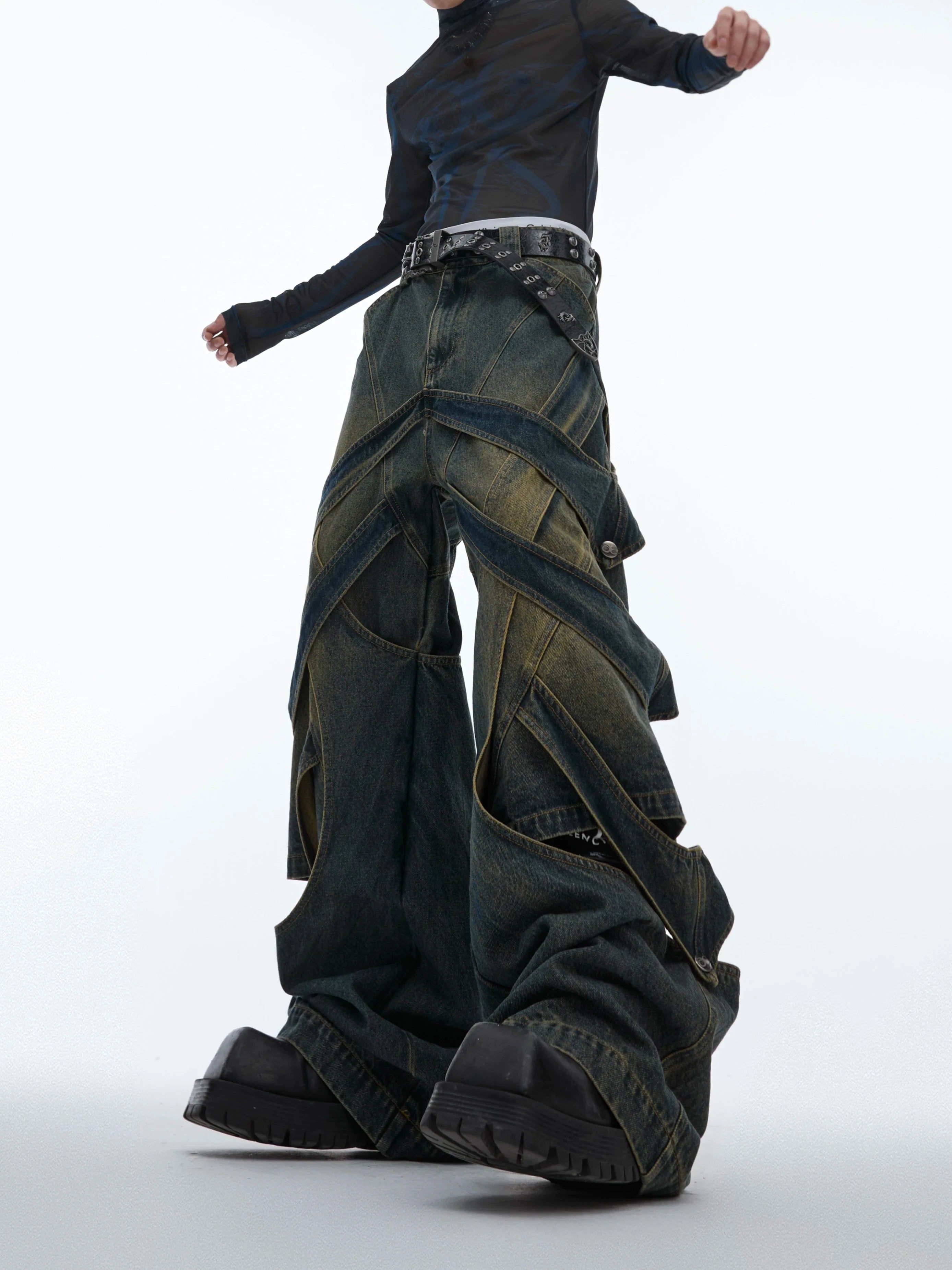 Front view of distressed wide-leg cargo jeans showing raw cutout details and deconstructed streetwear design