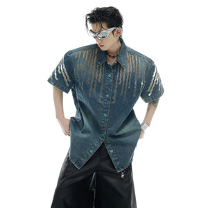 Side angle showing unique hollow-out shadow details and distressed cuffs on this streetwear denim jacket