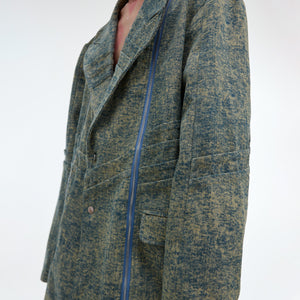 Layflat view of the deconstructed denim jacket showing all distressed details and unique blazer silhouette