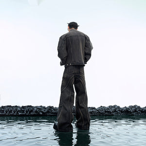 Side view of distressed vintage denim jacket with unique waxed finish and deconstructed streetwear design