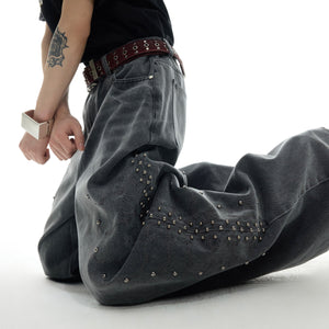 Detailed view of signature waistband on vintage washed jeans with streetwear styling