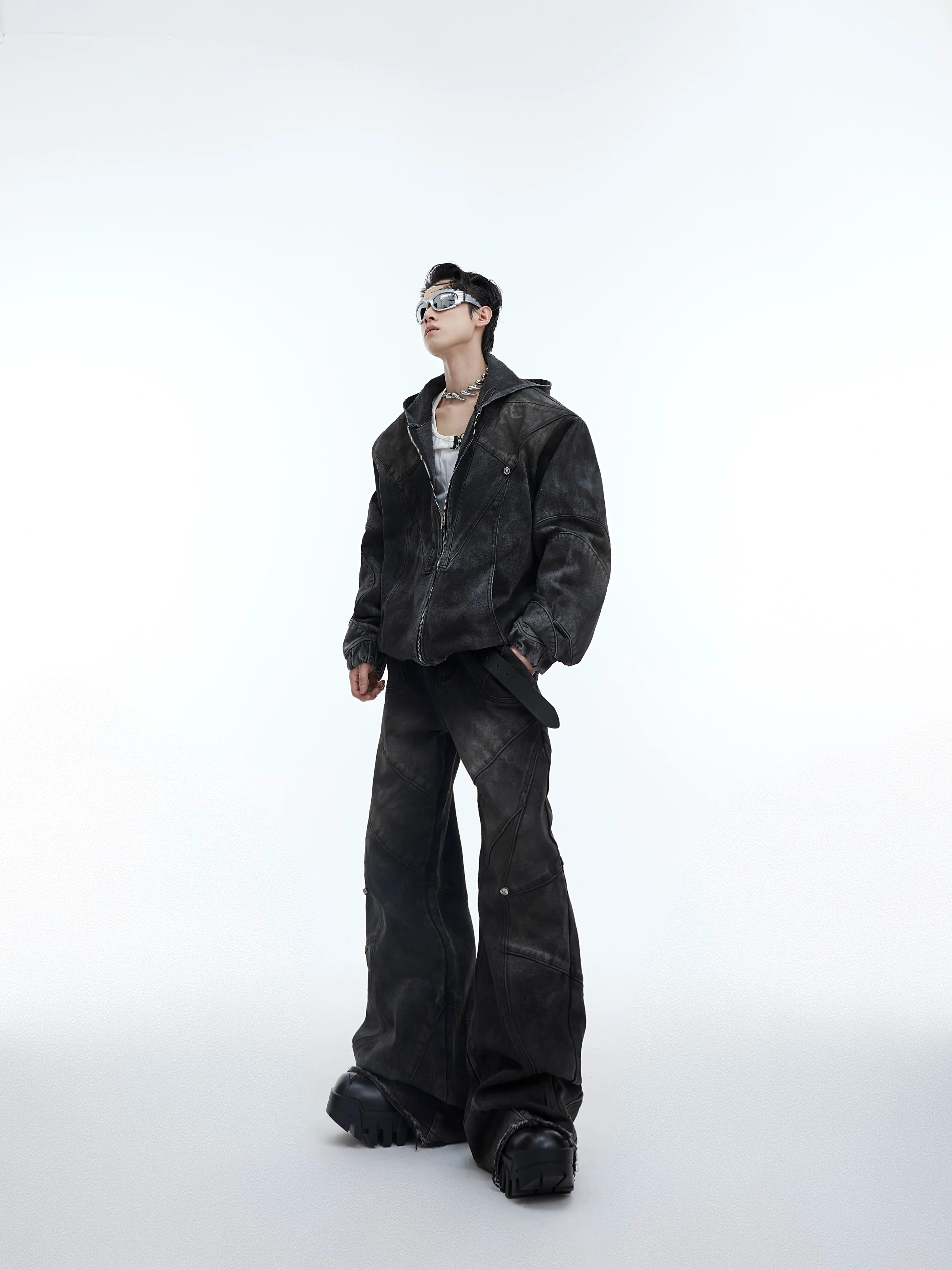 Deconstructed distressed denim set featuring bold metal accents and ripped detailing, urban streetwear style