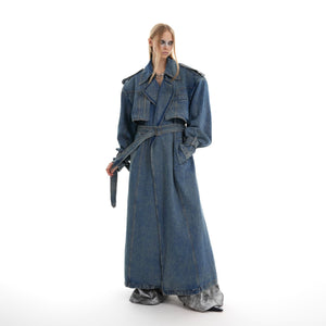 Distressed denim oversized trench coat with double-breasted front, showcasing unique streetwear style with vintage wash