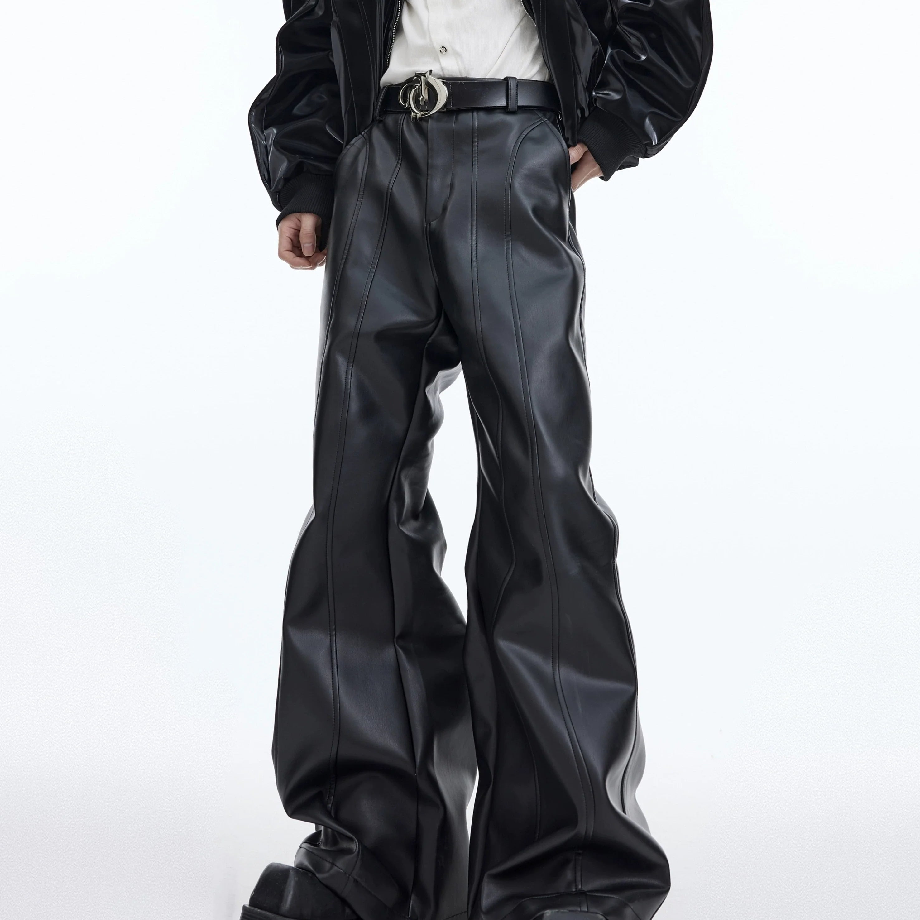 Front view of distressed high-waist leather pants with micro flare fit, showcasing the deconstructed matte finish and streetwear style
