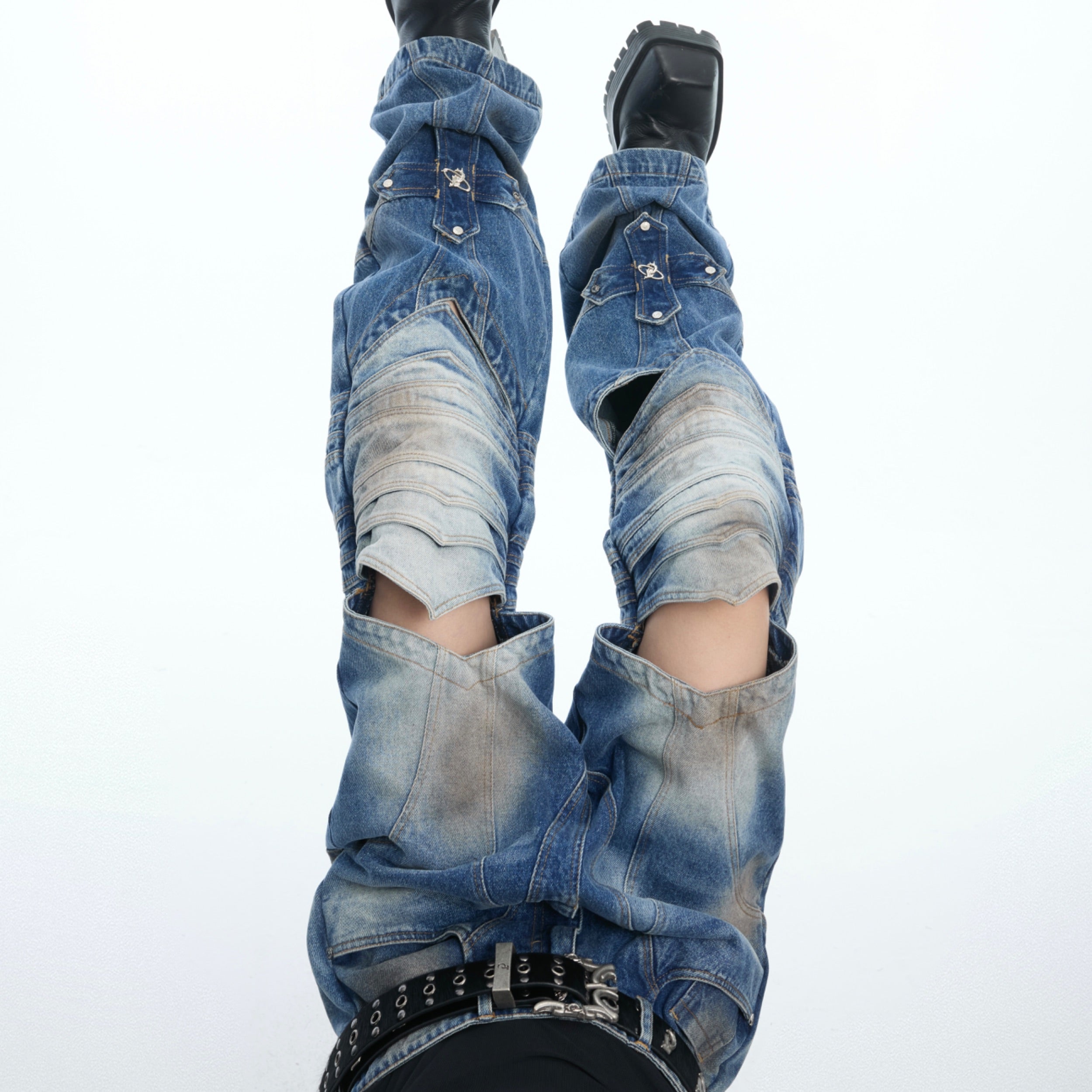 Side view of avant-garde jeans featuring cyberpunk-style cross cutout designs for urban fashion