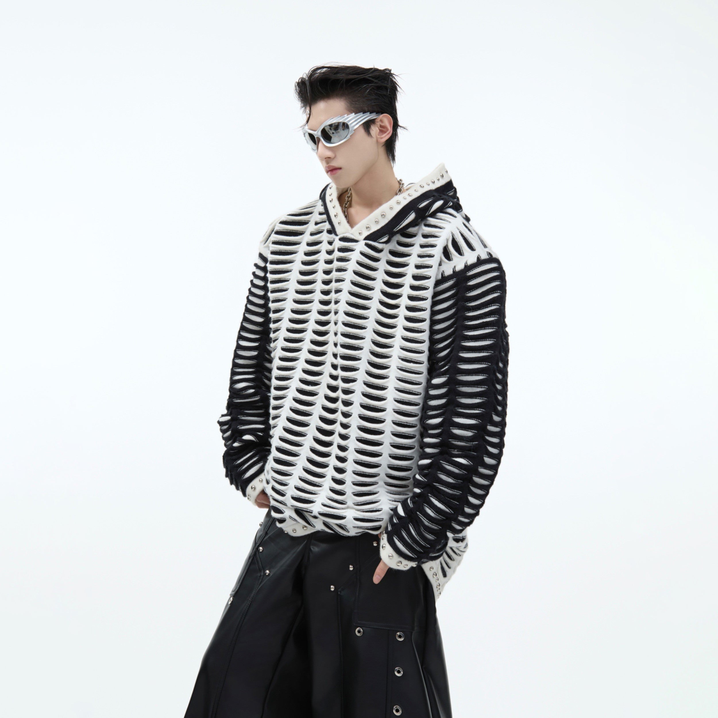 Close-up of the distressed hood with snow leopard pattern on heavyweight alpaca wool streetwear sweater