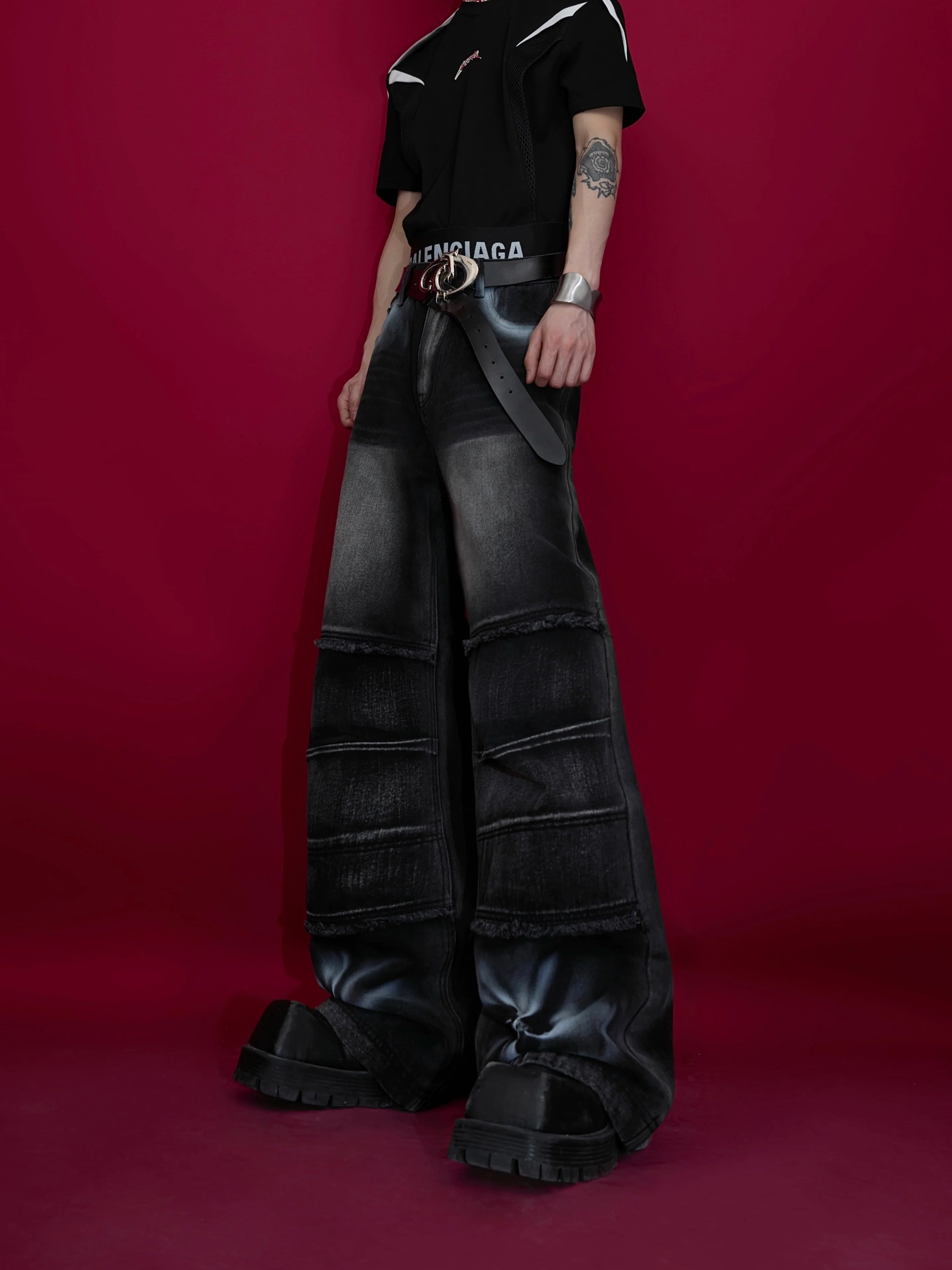 Front view of vintage washed distressed jeans with unique paint splatter design, relaxed fit for men