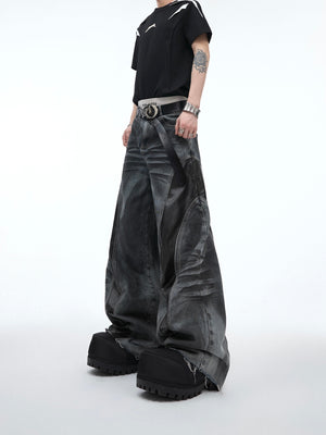 Distressed vintage loose jeans with unique PU leather patch detail, featuring raw hem edges and tie-dye wash