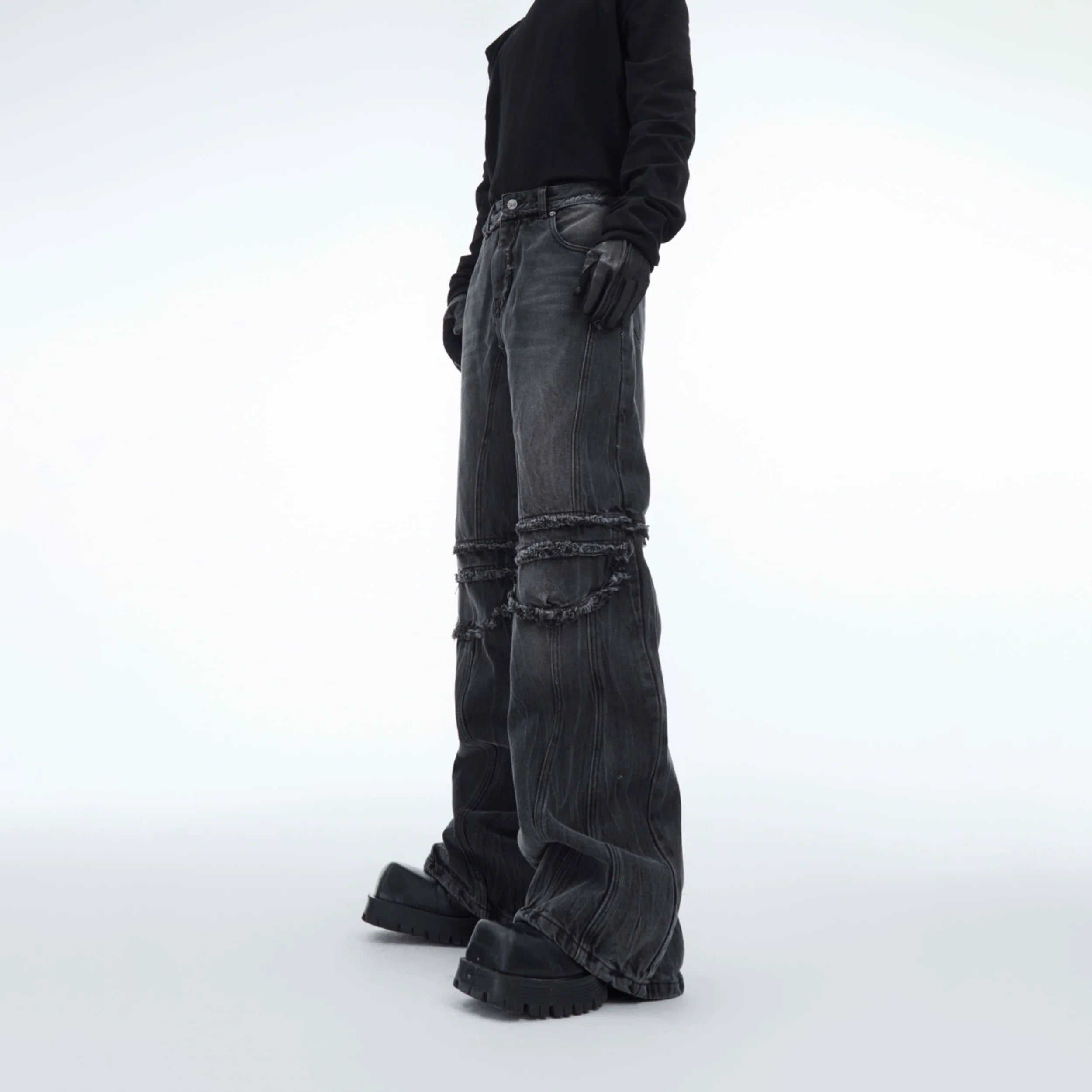 Distressed grey straight-leg jeans with raw hem and water ripple fringe detailing, perfect for edgy streetwear looks