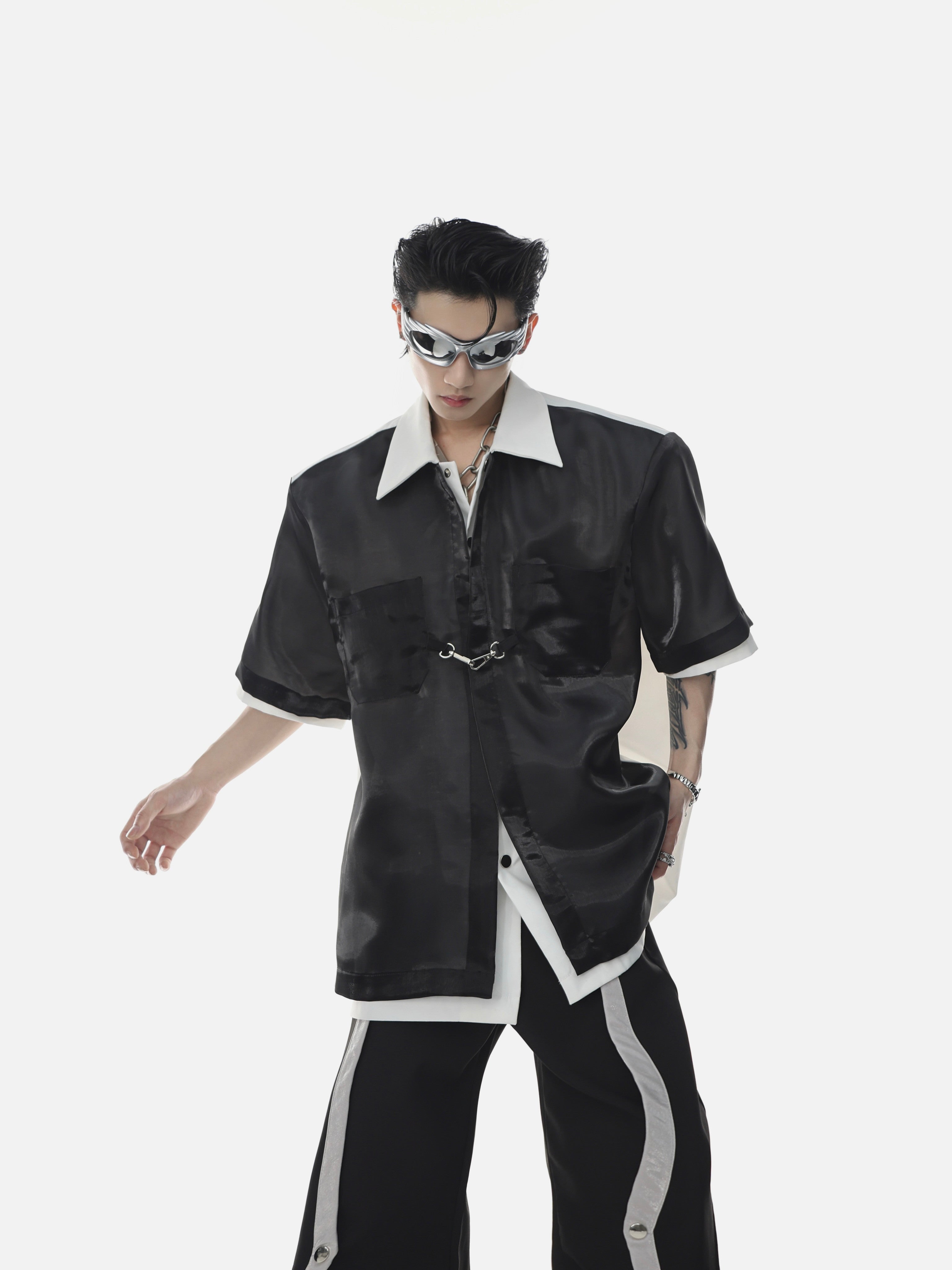 Deconstructed sleeveless shirt with sheer organza overlay, showcasing avant-garde streetwear design for summer