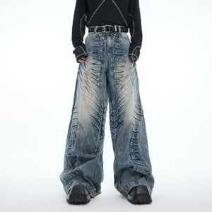 Back view of double pleated wide-leg jeans with unique distressed pattern and comfortable fit