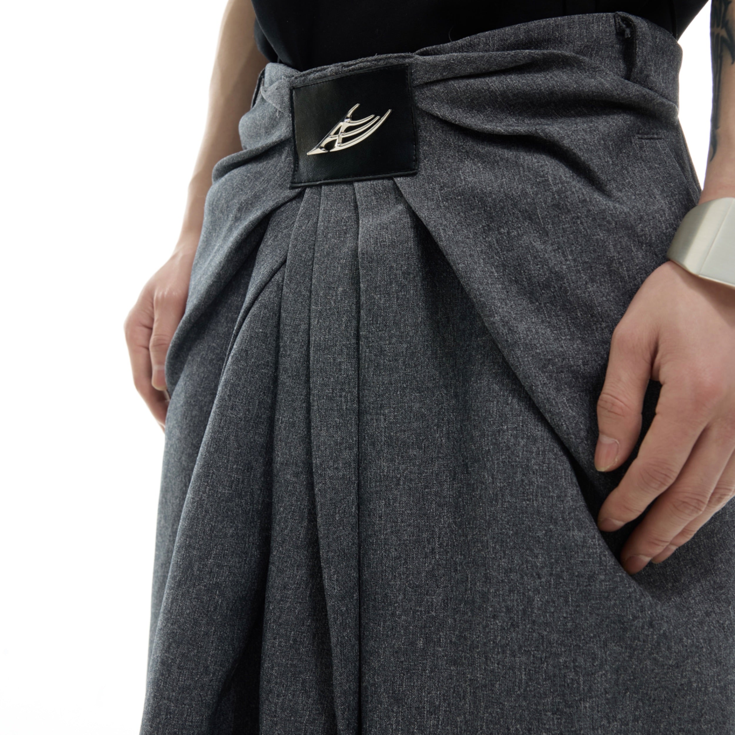 Relaxed drop-crotch trousers with premium metal hardware accents for an edgy urban look