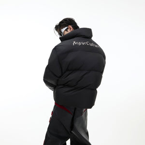 Reversible down jacket featuring metallic 3D logo detail, highlighting the premium quality and stylish design