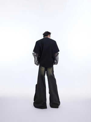 Side angle showing the eco-conscious fabric blend and distinctive metal logo detailing on this edgy t-shirt