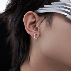 Stylish packaging of contemporary T-bar earrings presented on a modern jewelry display stand