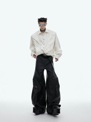 Detailed view of unique shoulder pad construction on this edgy textured streetwear shirt