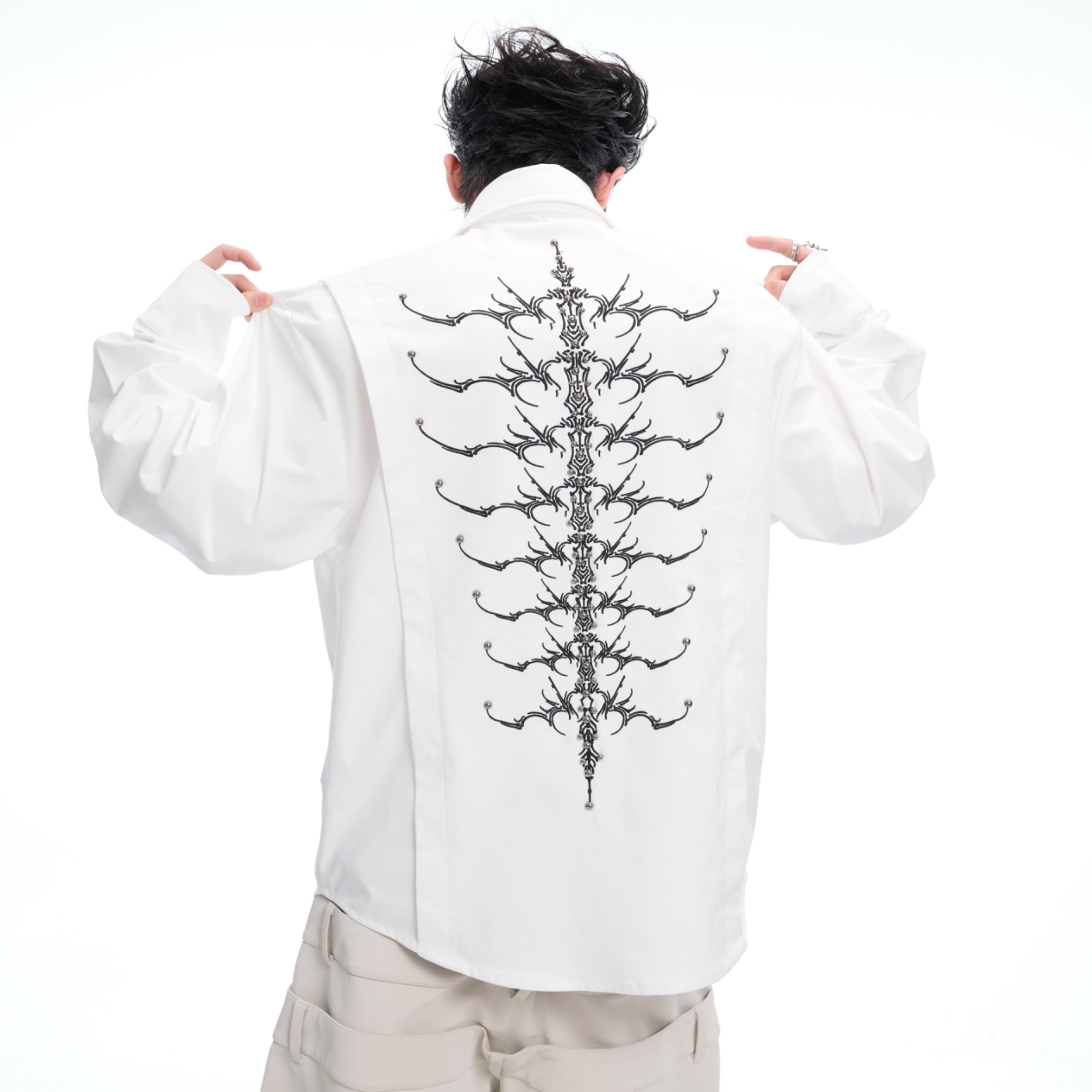 Embroidered studded spine shirt featuring intricate bone detailing on back, oversized streetwear long sleeve top