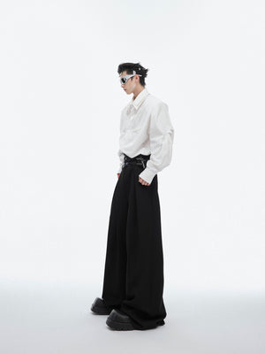 Back view showing contemporary layered hem design of this fashion-forward oversized shirt