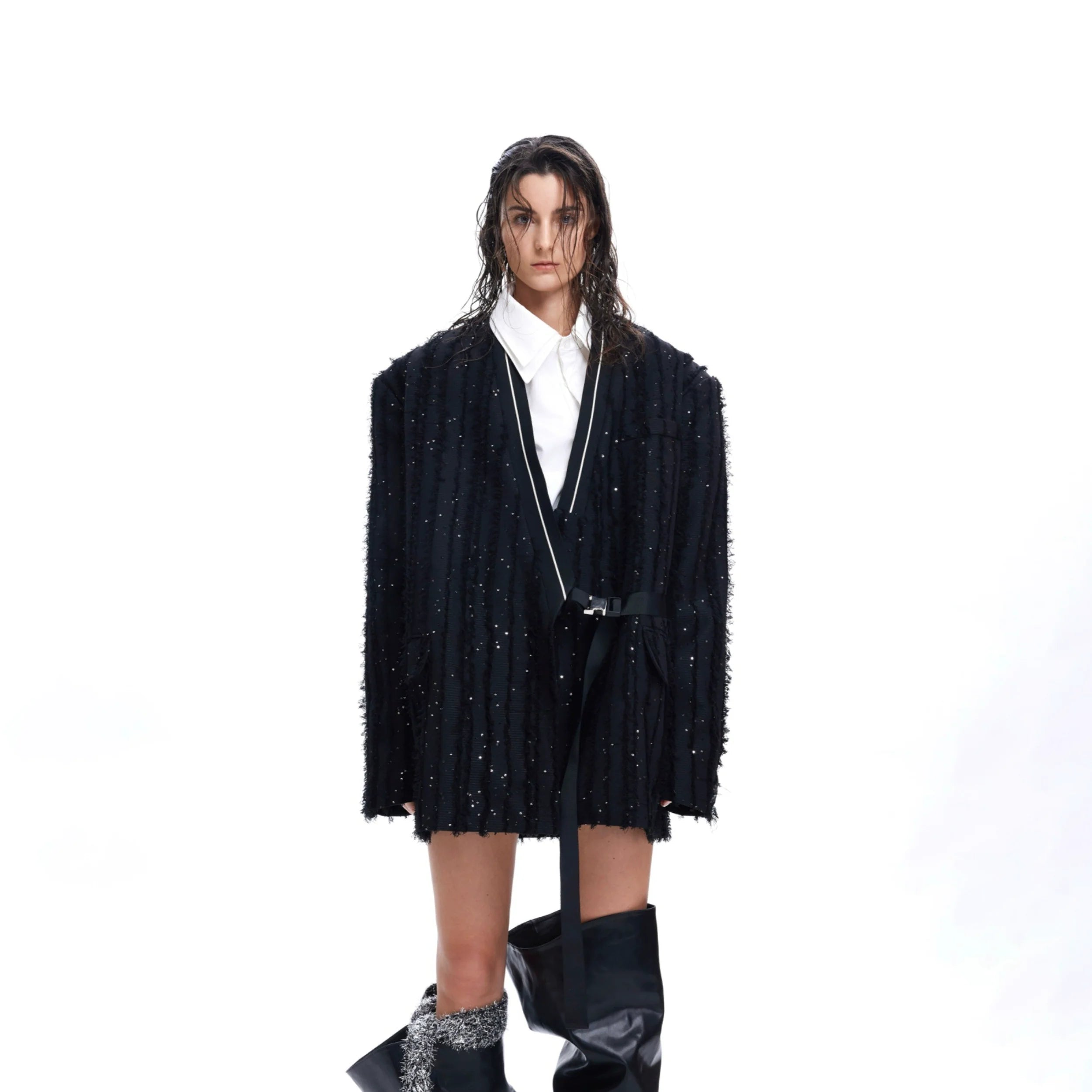 Front view of fringe texture blazer with dazzling sequin details, a statement streetwear jacket for bold fashion