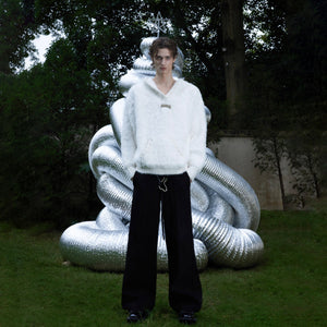 Back view of the warm oversized hoodie featuring unique pearl accents for stylish comfort