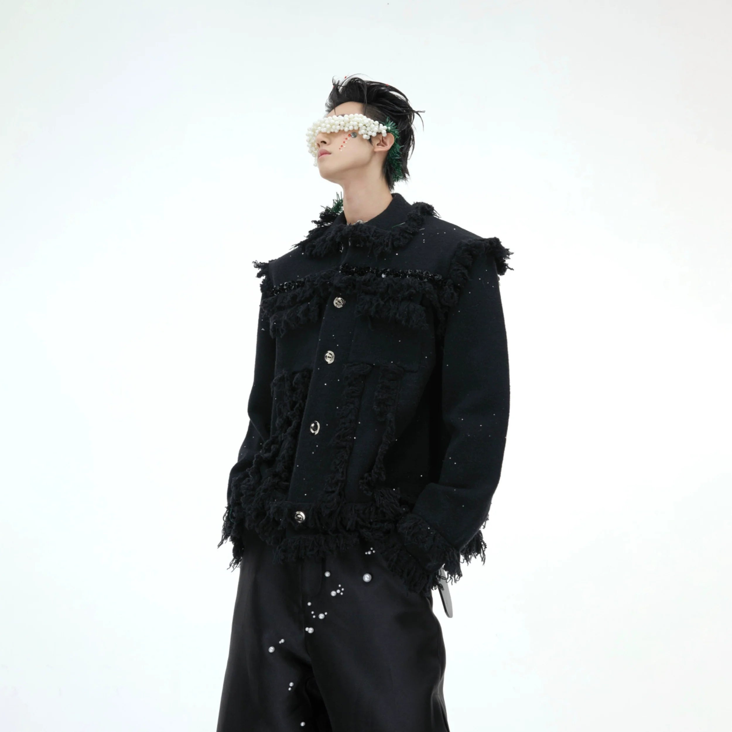 Front view of glitter fringe oversized knit sweater with shimmer details, perfect for streetwear fashion