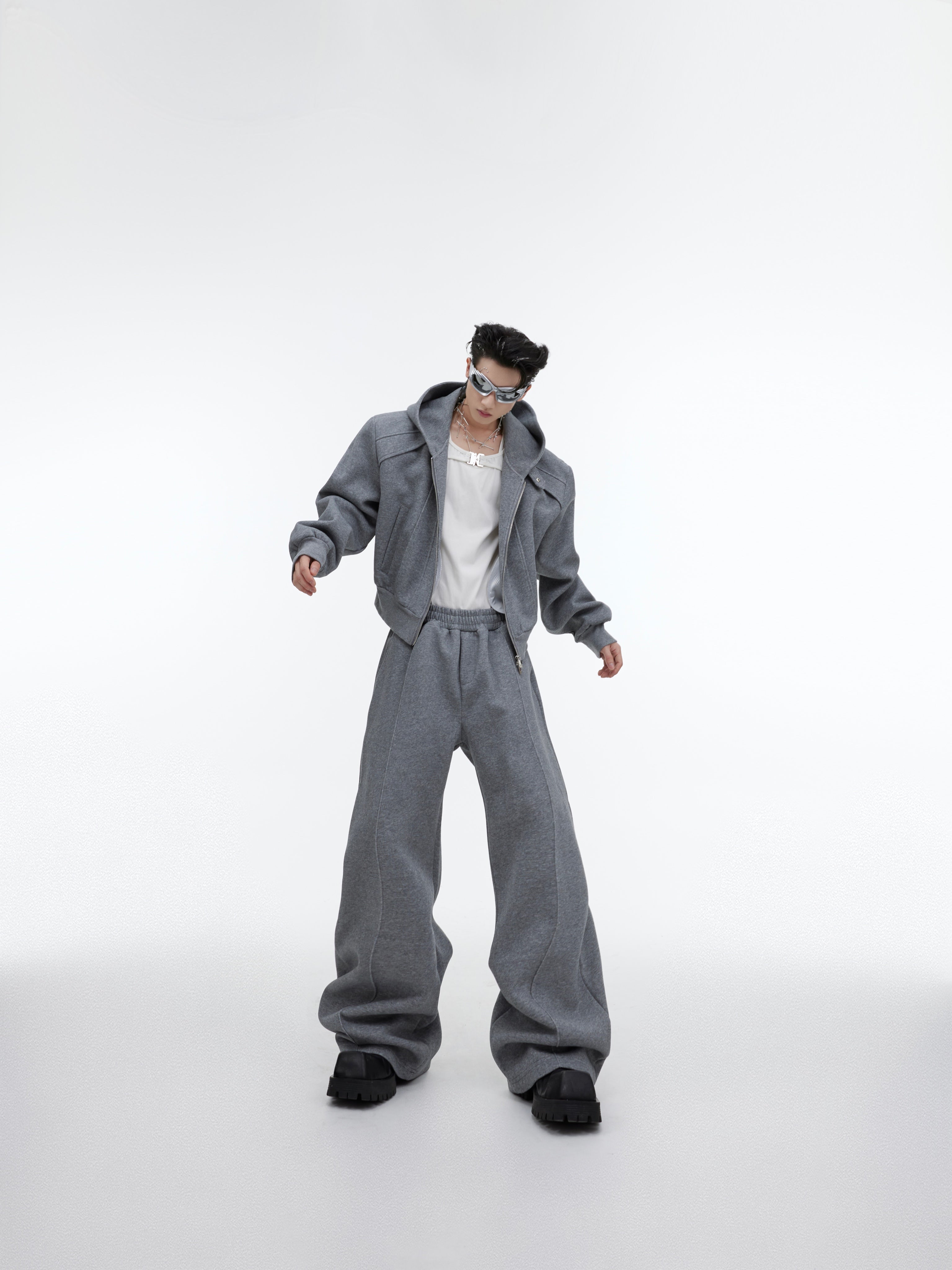 Side angle showing stretch fit of glitter streetwear pants with cropped hoodie set, featuring micro-sparkle fabric