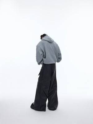 Fashion model wearing oversized graphic hoodie showcasing urban streetwear style