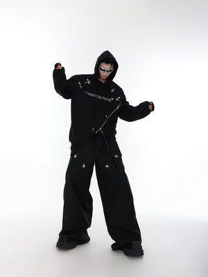 Detailed shot of metal grommet accents and heavy-duty zipper on deconstructed streetwear hoodie